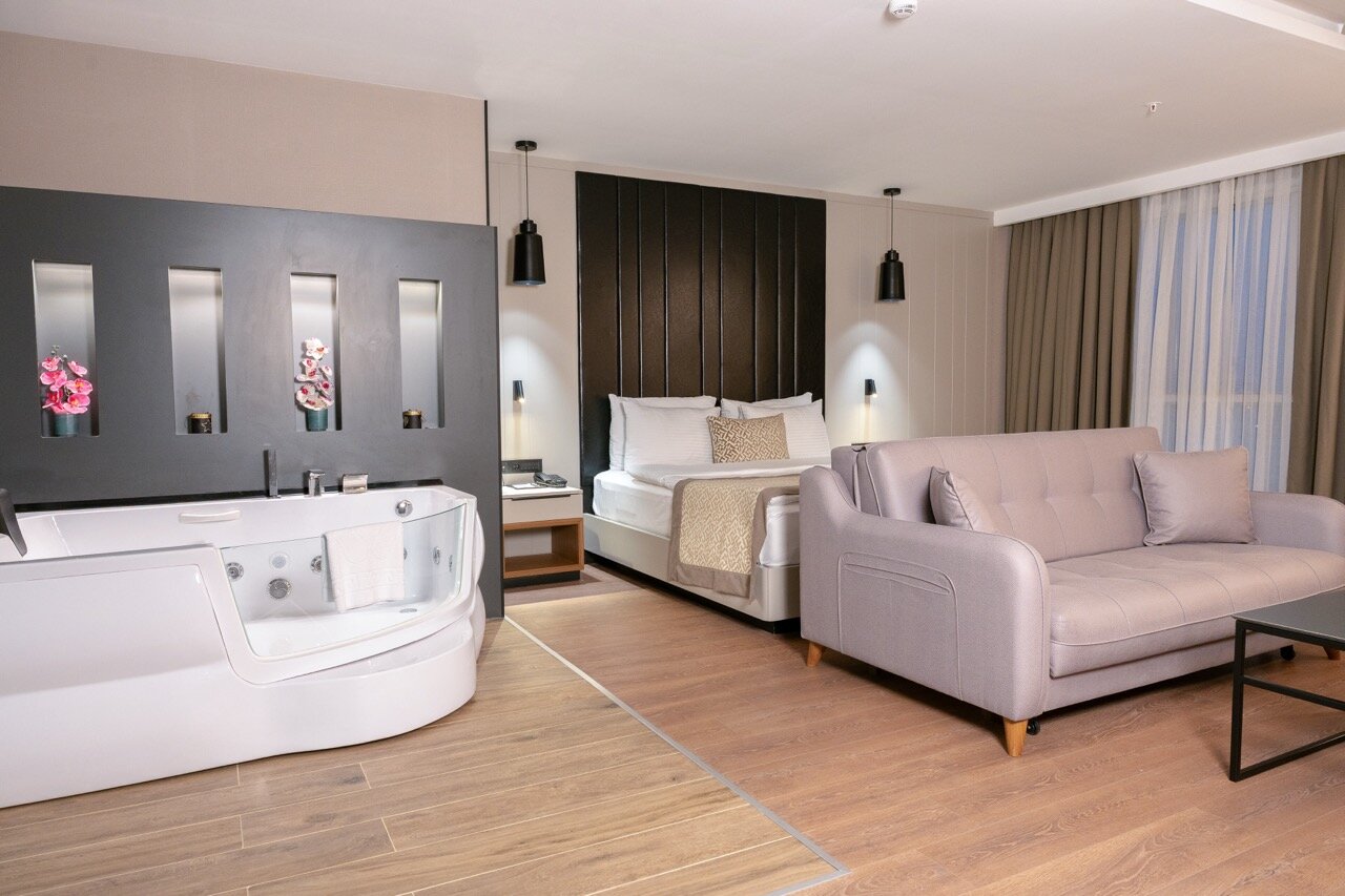 Corner Suite with Jacuzzi and Balcony